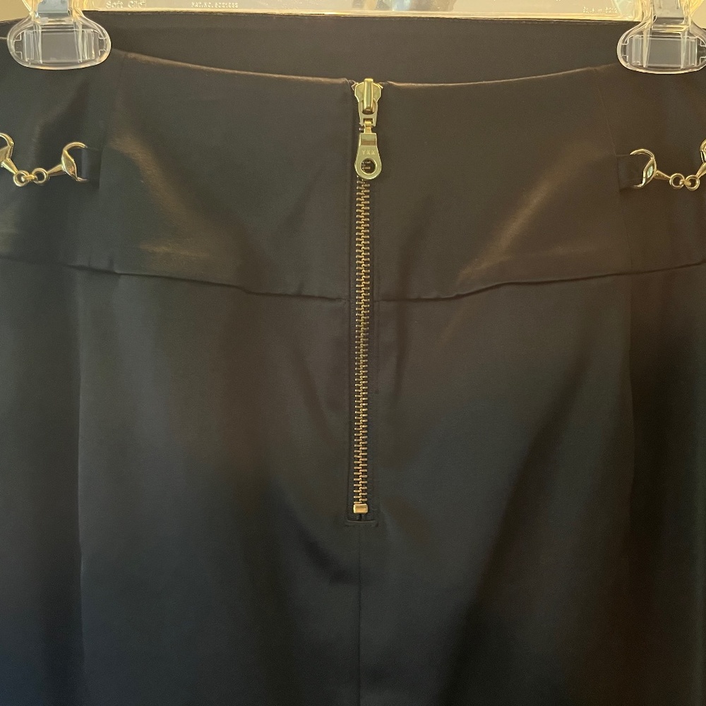 YKK Express Design Studio black skirt with gold embellishments on back side